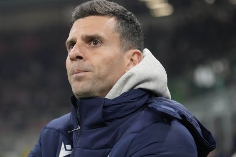 FILE - Bologna's head coach Thiago Motta waits for the start of an Italian Cup round of 16 soccer match between Inter Milan and Bologna, at the San Siro stadium in Milan, Italy, on Dec. 20, 2023. Thiago Motta was announced as Juventus new coach on Wednesday, June 12, 2024 replacing the fired Massimiliano Allegri. Juventus said Motta signed a three-year contract with the Bianconeri, having just steered Bologna to a Champions League finish. (AP Photo/Luca Bruno, File)