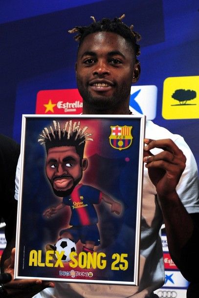 Barcelona new signing Cameroonian midfielder Alex Song poses after a press conference on August 21, 2012 at the Camp Nou stadium in Barcelona. Song is the latest star player to leave the Emirates Stadium after Barcelona agreed to pay 15 million pounds (19 million euros) for Song, who will have a release clause of 80 million euros inserted in his contract. AFP PHOTO/LLUIS GENE.        (Photo credit should read LLUIS GENE/AFP/GettyImages)