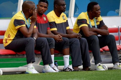 BRASILIA, BRAZIL - JUNE 22: Cameroon's forward and captain Samuel Eto'o (2L) sits on a bench during a training session at Mane Garrincha Stadium on June 22, 2014 in Brasilia, Brazil. (Photo by Buda Mendes/Getty Images)