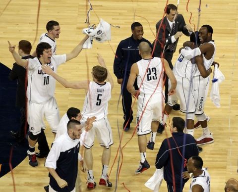 HOUSTON, TX - APRIL 04:  The Connecticut Huskies react after defeating the Butler Bulldogs to win the National Championship Game of the 2011 NCAA Division I Men's Basketball Tournament by a score of 53-41 at Reliant Stadium on April 4, 2011 in Houston, Texas.  (Photo by Andy Lyons/Getty Images)