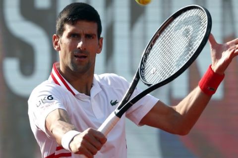 Novak Djokovic of Serbia returns a ball to Korea's Kwon Soonwoo during their tennis match of the Serbia Open tennis tournament in Belgrade, Serbia, Wednesday, April 21, 2021. (AP Photo/Darko Vojinovic)