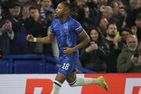 Chelsea's Christopher Nkunku celebrates after scoring his side's third goal during the Europa Conference League opening phase soccer match between Chelsea and Gent at Stamford Bridge in London, Thursday, Oct. 3, 2024. (AP Photo/Kin Cheung)