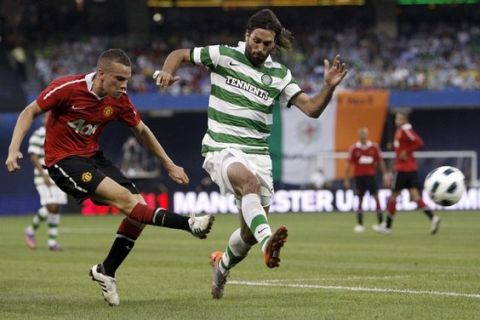 TORONTO - JULY 16: Tom Cleverly #35 of Manchester United kicks the ball from Georgios Samaras #9 of Celtic F.C. during a friendly match at the Rogers Centre July 16, 2010 in Toronto, Ontario, Canada. (Photo by Abelimages/Getty Images)