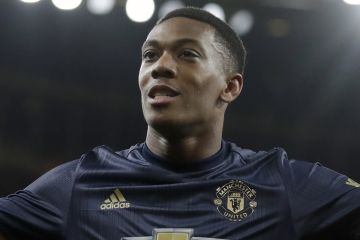 Manchester United's Anthony Martial celebrates after scoring his side's third goal during the English FA Cup fourth round soccer match between Arsenal and Manchester United at the Emirates stadium in London, Friday, Jan. 25, 2019. (AP Photo/Matt Dunham)