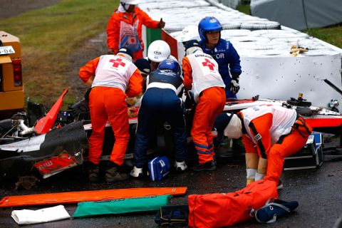 SUZUKA, JAPAN - OCTOBER 05:  Jules Bianchi of France and Marussia receives urgent medical treatment after crashing during the Japanese Formula One Grand Prix at Suzuka Circuit on October 5, 2014 in Suzuka, Japan.  (Photo by Getty Images/Getty Images)