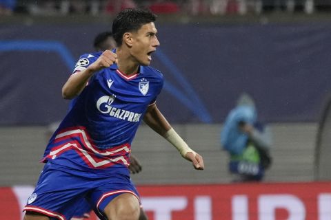 Red Star's Marko Stamenic celebrates after scoring his side's opening goal during the group G Champions League soccer match between RB Leipzig and Red Star Belgrade at the Red Bull arena stadium in Leipzig, Germany, Wednesday, Oct. 25, 2023. (AP Photo/Matthias Schrader)