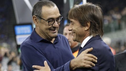 Inter Milan's head coach Antonio Conte and Juventus' head coach Maurizio Sarri, left, prior to the Serie A soccer match between Inter Milan and Juventus, at the San Siro stadium in Milan, Italy, Sunday, Oct. 6, 2019. (AP Photo/Luca Bruno)