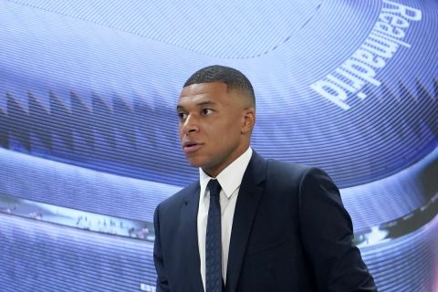 Kylian Mbappe, of France, leaves at the end of a news conference after being presented to fans as a new Real Madrid player at the Santiago Bernabeu stadium in Madrid, Tuesday, July 16, 2024. (AP Photo/Andrea Comas)