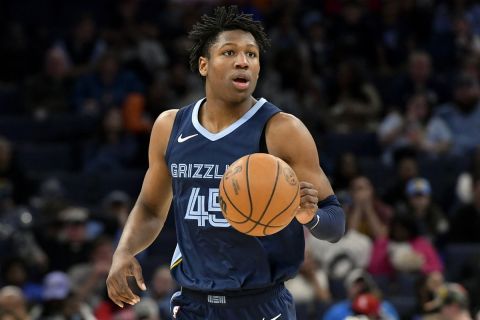 Memphis Grizzlies forward GG Jackson II (45) handles the ball in the second half of an NBA basketball game against the Detroit Pistons Friday, April 5, 2024, in Memphis, Tenn. (AP Photo/Brandon Dill)