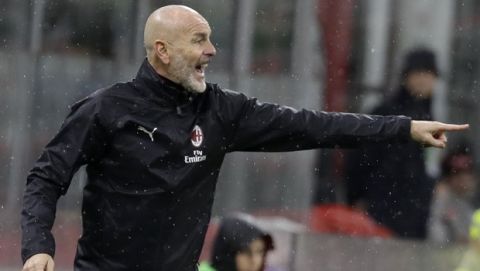 AC Milan's manager Stefano Pioli gestures during a Serie A soccer match between AC Milan and Napoli, at the San Siro stadium in Milan, Italy, Saturday, Nov. 23, 2019. (AP Photo/Luca Bruno)