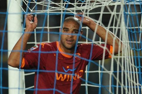 AS Roma Brazilian forward Adriano reacts in the net at the end of Italian serie A football match Brescia vs As Roma at Mario Rigamonti stadium in Brescia on September 22, 2010. Brescia won 2-1. AFP PHOTO / ALBERTO PIZZOLI (Photo credit should read ALBERTO PIZZOLI/AFP/Getty Images)