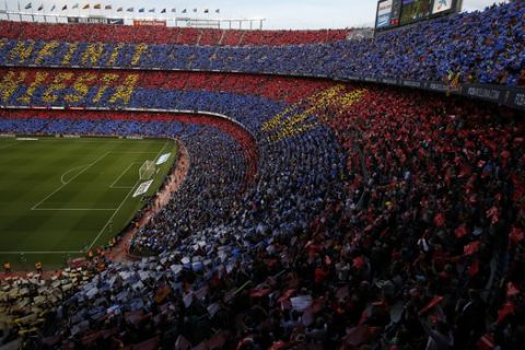 FC Barcelona's supporters pay tribute to Barcelona's Andres Iniesta prior of the Spanish La Liga soccer match between FC Barcelona and Real Sociedad at the Camp Nou stadium in Barcelona, Spain, Sunday, May 20, 2018. Iniesta announced last month he would leave Barcelona after 16 seasons. (AP Photo/Manu Fernandez)