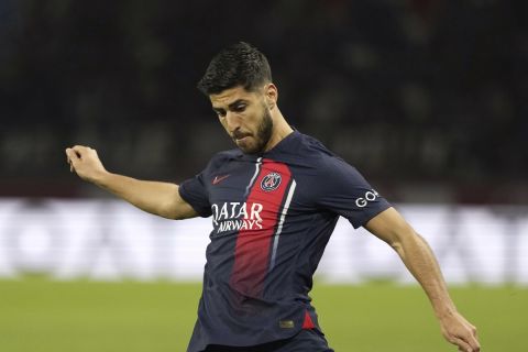 PSG's Marco Asensio kicks the ball during the French League One soccer match between Paris Saint-Germain and Clermont-Ferrand at the Parc des Princes stadium in Paris, Saturday, April 6, 2024. (AP Photo/Lewis Joly)