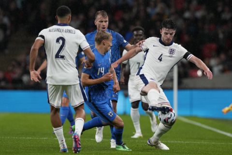 England's Declan Rice, right, is challenged by Finland's Topi Keskinen during the Group F UEFA Nations League soccer match between England and Finland at Wembley Stadium in London, Tuesday, Sept. 10, 2024. (AP Photo/Frank Augstein)