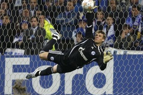 Schalke's goalkeeper Manuel Neuer saves a second penalty from FC Porto during their Champions League second round soccer match at the Dragao stadium in Porto, Portugal, Wednesday March 5, 2008. The game ended in a 1-1 aggregate tie and FC Schalke 04 advance after winning 4-1 in the penalty shoot out. (AP Photo/Paulo Duarte)