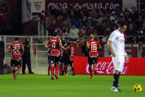 Mallorca's French midfielder Michael Pereira (L, back, obscured) celebrates with teammates after scoring against Sevilla during their Liga football match at Ramon Sanchez Pizjuan stadium on November 21, 2010, in Sevilla. AFP PHOTO/ JORGE GUERRERO (Photo credit should read Jorge Guerrero/AFP/Getty Images)