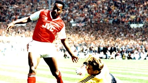 Luton Towns goalkeeper Andy Diddle is at full stretch as he pushes the ball away from the feet of Arsenals Michael Thomas during the final of the Littlewoods Challenge Cup Final at Wembley Stadium in London,, April 24, 1988. A last minute goal by Lutons Brian Stein gave them victory by three goals to two over Arsenal, who were defending the up they won last season. (AP Photo)