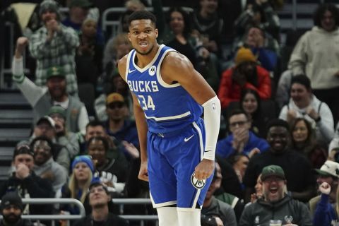 Milwaukee Bucks' Giannis Antetokounmpo reacts after dunking during the first half of an NBA basketball game against the Washington Wizards, Saturday, Nov. 30, 2024, in Milwaukee. (AP Photo/Aaron Gash)