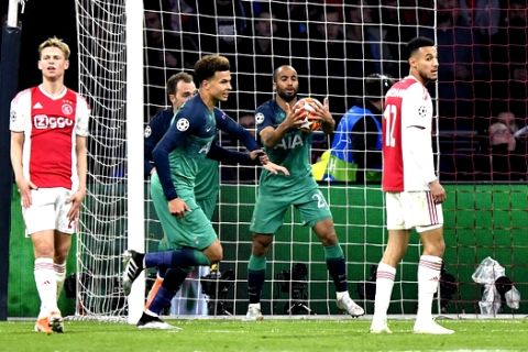 Tottenham's Lucas Moura, center, celebrates after scoring his side's opening goal during the Champions League semifinal second leg soccer match between Ajax and Tottenham Hotspur at the Johan Cruyff ArenA in Amsterdam, Netherlands, Wednesday, May 8, 2019. (AP Photo/Martin Meissner)