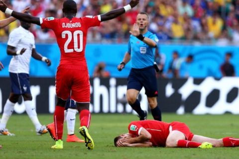 SALVADOR, BRAZIL - JUNE 20:  Steve von Bergen of Switzerland lies on the pitch after a collision during the 2014 FIFA World Cup Brazil Group E match between Switzerland and France at Arena Fonte Nova on June 20, 2014 in Salvador, Brazil.  (Photo by Elsa/Getty Images)