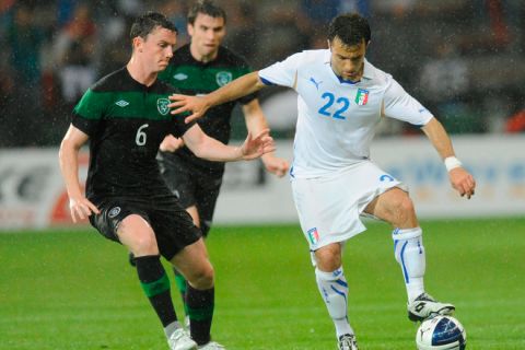 Ireland's Kevin Foley (L) vies with Italy's forward Guissepe Rossi (R) during their EURO 2012 friendly football match Italy vs Ireland in Liege, on June 7, 2011.     AFP PHOTO/ JOHN THYS (Photo credit should read JOHN THYS/AFP/Getty Images)