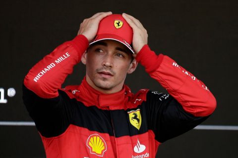 Ferrari driver Charles Leclerc of Monaco gestures after setting the pole position in the qualifying session at the Barcelona Catalunya racetrack in Montmelo, Spain, Saturday, May 21, 2022. The Formula One race will be held on Sunday. (AP Photo/Joan Monfort)