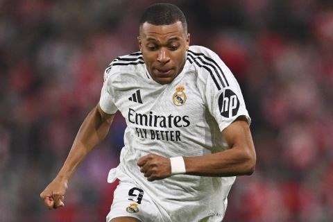 Real Madrid's Kylian Mbappe runs during the Spanish La Liga soccer match between Athletic Bilbao and Real Madrid at the San Mames stadium in Bilbao, Spain, Wednesday, Dec. 4, 2024. (AP Photo/Miguel Oses)