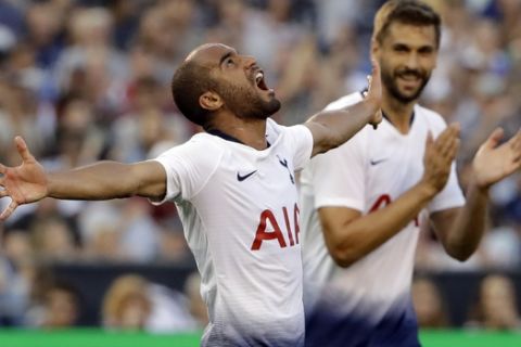 Tottenham midfielder Lucas Moura, left, reacts after scoring a goal as forward Fernando Llorente (18) applauds during the first half of the team's International Champions Cup tournament soccer match against Roma on Wednesday, July 25, 2018, in San Diego. (AP Photo/Gregory Bull)