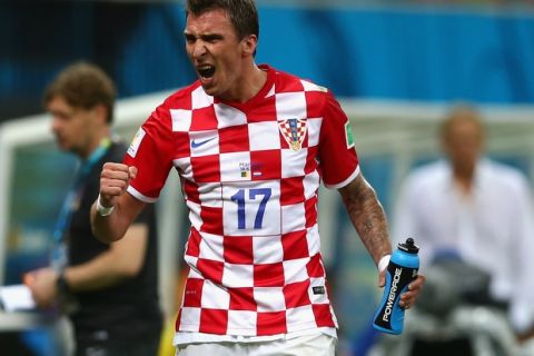 MANAUS, BRAZIL - JUNE 18:  Mario Mandzukic of Croatia celebrates scoring his team's third goal during the 2014 FIFA World Cup Brazil Group A match between Cameroon and Croatia at Arena Amazonia on June 18, 2014 in Manaus, Brazil.  (Photo by Clive Brunskill/Getty Images)