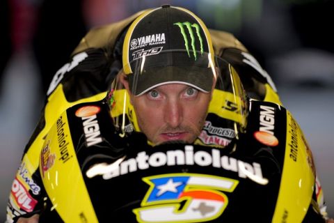 Yamaha's tech 3 US Colin Edwards looks on in the pits during the Moto GP first practice session of the Catalunya Grand Prix at the Catalunya racetrack on June 3, 2011, in Montmelo, near Barcelona. AFP PHOTO / JOSEP LAGO (Photo credit should read JOSEP LAGO/AFP/Getty Images)