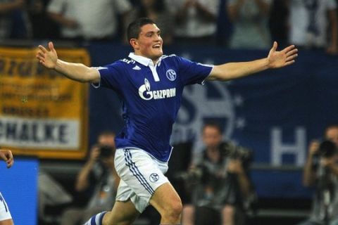 Schalke`s Greek midfielder Kyriakos Papadopoulos celebrates after the 4-1 during the UEFA Europa League playoff football match Schalke 04 vs. HJK Helsinki in the western German city of Gelsenkirchen on August 25, 2011. AFP PHOTO / PATRIK STOLLARZ (Photo credit should read PATRIK STOLLARZ/AFP/Getty Images)