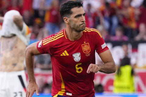 Spain's Mikel Merino celebrates after scoring his sides second goal during a quarter final match between Germany and Spain at the Euro 2024 soccer tournament in Stuttgart, Germany, Friday, July 5, 2024. (AP Photo/Manu Fernandez)