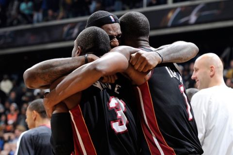 WASHINGTON, DC - DECEMBER 18:  LeBron James #6 of the Miami Heat celebrates with Dwyane Wade #3 and Chris Bosh #1 after a 95-94 victory over the Washington Wizards at the Verizon Center on December 18, 2010 in Washington, DC. NOTE TO USER: User expressly acknowledges and agrees that, by downloading and or using this Photograph, user is consenting to the terms and conditions of the Getty Images License Agreement.   (Photo by Greg Fiume/Getty Images)