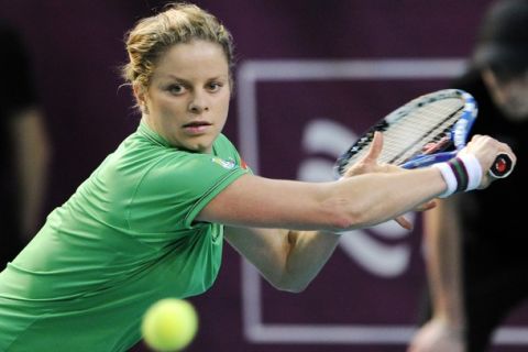 Belgium's Kim Clijsters returns the ball to Australia's Jelena Dokic during their Women's Paris WTA Open tennis match on February 11, 2011 in Paris. AFP PHOTO / BERTRAND GUAY (Photo credit should read BERTRAND GUAY/AFP/Getty Images)