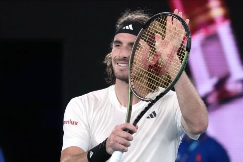 Stefanos Tsitsipas of Greece celebrates after defeating Rinky Hijikata of Australia in their second round match at the Australian Open tennis championship in Melbourne, Australia, Wednesday, Jan. 18, 2023. (AP Photo/Dita Alangkara)