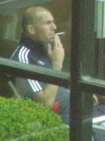 Zinedine Zidane, French captain, photographed smoking during the World Cup tournament at the Intercontinental Hotel, Frankfurt on Friday 30th June 2006 *** Local Caption *** SINGLE USE ONLY. NO ELECTRONIC OR INTERNET USE. NO LIBRARY USE. 
To licence this image contact Scoopt +44 (0) 7092 867106 . 
email sales@scoopt.com
www.scoopt.com 
Credit must read Scoopt.com
End users shall not licence, sell, transmit or otherwise distribute any images represented by Scoopt. 
See http://www.scoopt.com/ScooptT&C.pdf