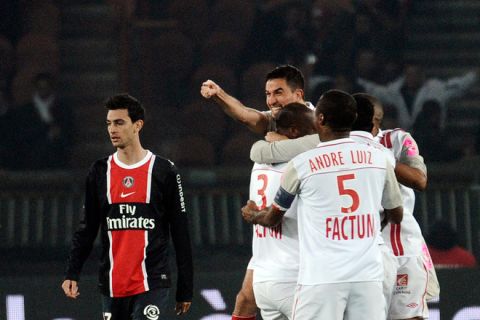 Nancy's French defender Jean Calve (2ndL) is congratulated by his teammates after scoring a goal during the French L1 football match Paris vs. Nancy on November 20, 2011 at the Parc des Princes in Paris. AFP PHOTO / FRED DUFOUR (Photo credit should read FRED DUFOUR/AFP/Getty Images)