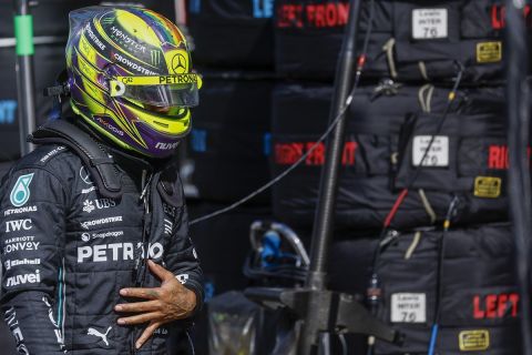 British Formula One driver Lewis Hamilton of Mercedes-AMG Petronas walks from his car during the qualifying session ahead of Sunday's Formula One Dutch Grand Prix auto race, at the Zandvoort racetrack, in Zandvoort, Netherlands, Saturday, Aug. 26, 2023. (Simon Wohlfart/Pool via AP)