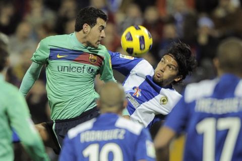 Barcelona's forward Pedro Rodriguez (L) vies for the ball with Hercules' Colombian midfielder Abel Aguilar during the Spanish league football match Hercules CF vs FC Barcelona on January 29, 2011 at the Jose Rico Perez stadium in Alicante.    AFP PHOTO/ JOSE JORDAN (Photo credit should read JOSE JORDAN/AFP/Getty Images)