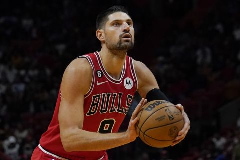 Chicago Bulls center Nikola Vucevic (9) aims for the basket during the first half of an NBA game against the Miami Heat, Wednesday, Oct. 19, 2022, in Miami. (AP Photo/Marta Lavandier)