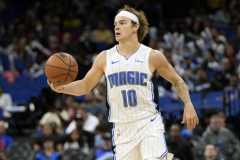 Orlando Magic guard Mac McClung (10) moves the ball against Brazil Flamengo during the second half of a preseason NBA basketball game, Friday, Oct. 20, 2023, in Orlando, Fla. (AP Photo/John Raoux)