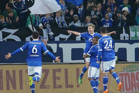 GELSENKIRCHEN, GERMANY - FEBRUARY 09:  Max Meyer of Schalke 04 celebrates with teammates after scoring his team's second goal during the Bundesliga match between FC Schalke 04 and Hannover 96 at Veltins-Arena on February 9, 2014 in Gelsenkirchen, Germany.  (Photo by Dennis Grombkowski/Bongarts/Getty Images)