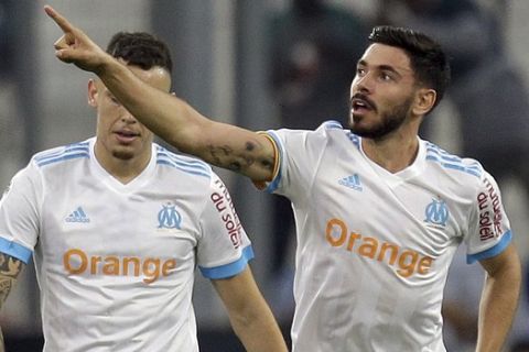 Marseille's midfielder Morgan Sanson, celebrates after scoring during the League One soccer match between Marseille and Amiens at the Velodrome stadium, in Marseille, southern France, Saturday, May 19, 2018. (AP Photo/Claude Paris)