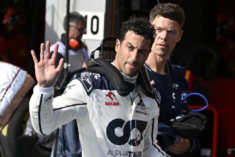 AlphaTauri driver Daniel Ricciardo of Australia waves as he walks near his team garage during the qualifying session ahead of the Formula One Grand Prix at the Spa-Francorchamps racetrack in Spa, Belgium, Friday, July 28, 2023. The Belgian Formula One Grand Prix will take place on Sunday. (John Thys, Pool Photo via AP)