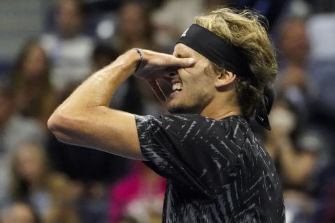 Alexander Zverev, of Germany, reacts after losing a point to Novak Djokovic, of Serbia, during the semifinals of the US Open tennis championships, Friday, Sept. 10, 2021, in New York. (AP Photo/Elise Amendola)