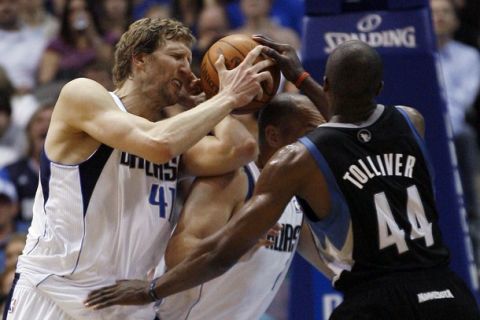 Dallas Mavericks power forward Dirk Nowitzki (L-R), point guard Jason Kidd and Minnesota Timberwolves center Anthony Tolliver  battle for the ball during the second half of their NBA basketball game in Dallas, Texas March 24, 2011.  REUTERS/Mike Stone (UNITED STATES - Tags: SPORT BASKETBALL)