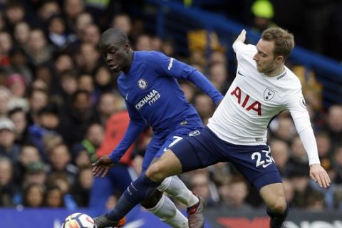 Tottenham's Christian Eriksen, right, duels for the ball with Chelsea's N'golo Kante during the English Premier League soccer match between Chelsea and Tottenham Hotspur at Stamford Bridge stadium in London, Sunday, April 1, 2018. (AP Photo/Alastair Grant)