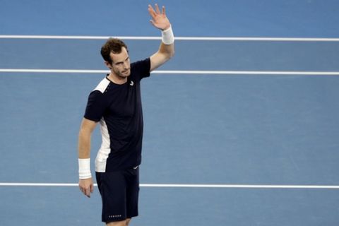 Britain's Andy Murray waves to the crowd after his first round loss to Spain's Roberto Bautista Agut at the Australian Open tennis championships in Melbourne, Australia, Monday, Jan. 14, 2019.(AP Photo/Mark Schiefelbein)