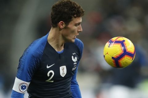 France's Benjamin Pavard controls the ball during the international friendly soccer match between France and Uruguay at the Stade de France stadium in Saint-Denis, outside Paris, Tuesday, Nov.20, 2018. (AP Photo/Christophe Ena)