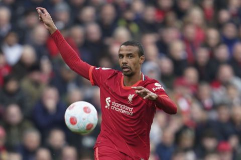 Liverpool's Joel Matip controls the ball during the English Premier League soccer match between Liverpool and Watford at Anfield stadium in Liverpool, England, Saturday, April 2, 2022. (AP Photo/Jon Super)